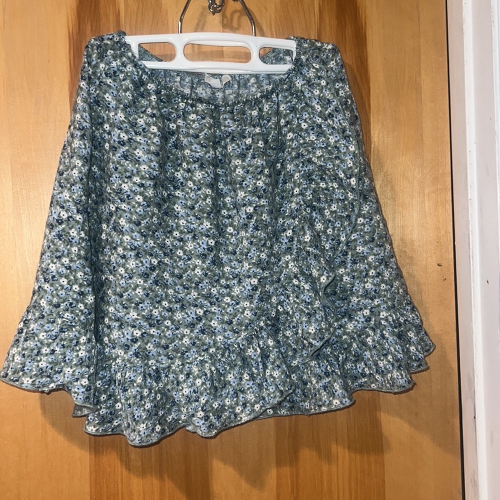 Floral cross over ruffle mini skirt from Brandy Spain